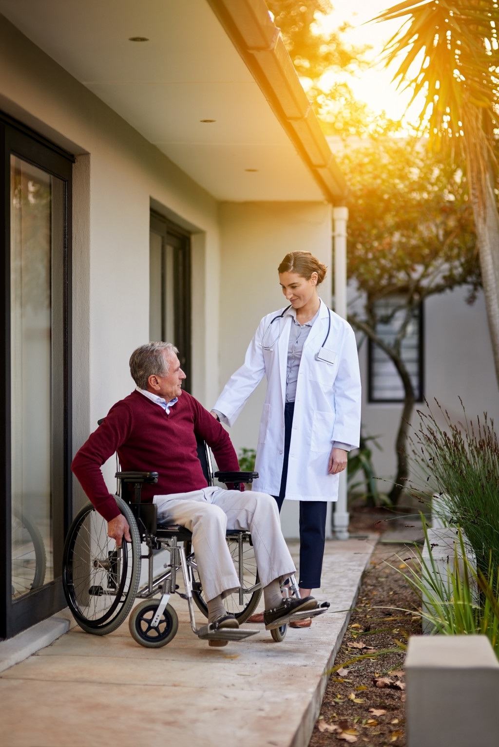 assisted living nurse with man in wheelchair in miami florida